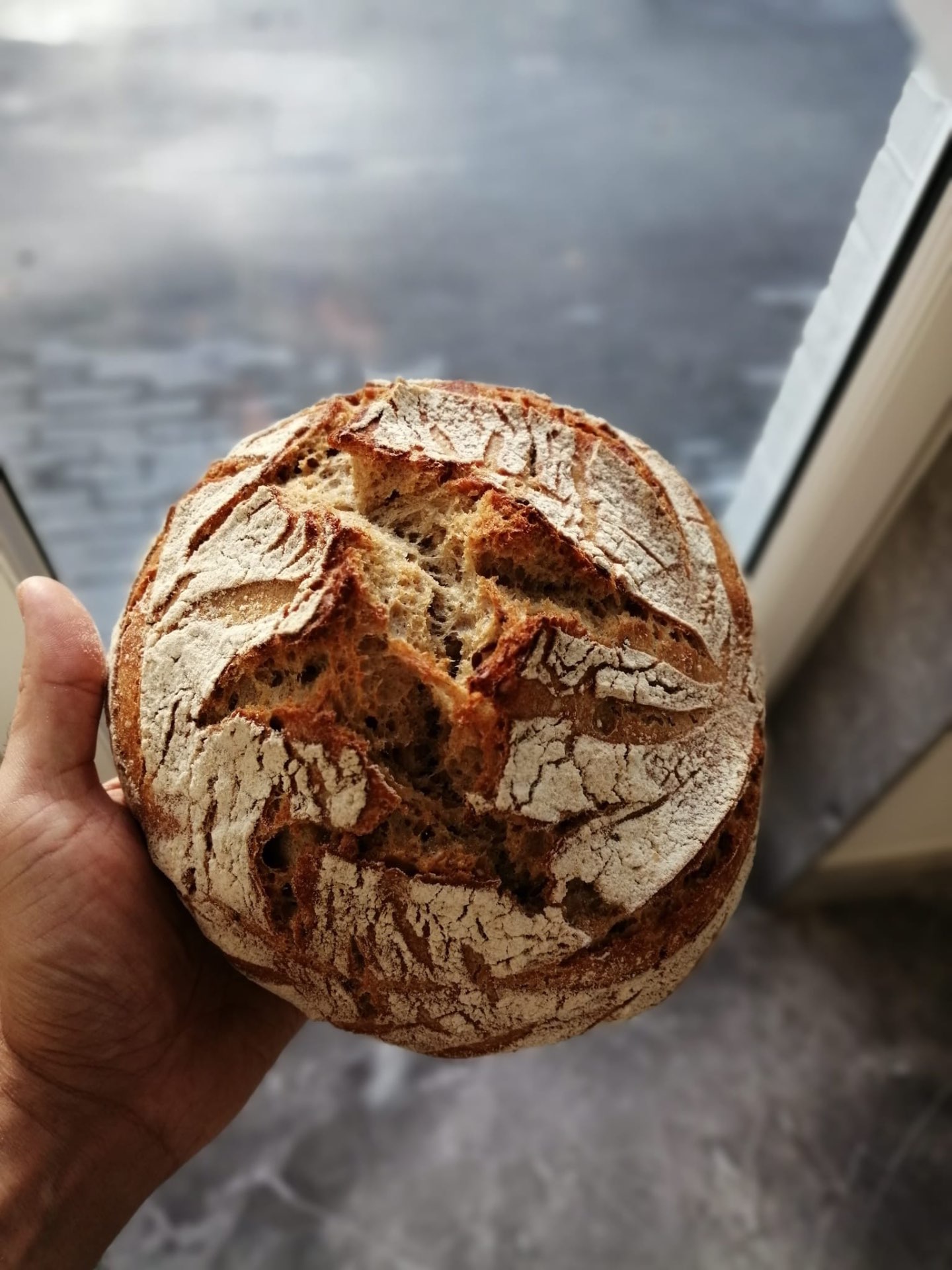 Sourdough loaf dusted with flour