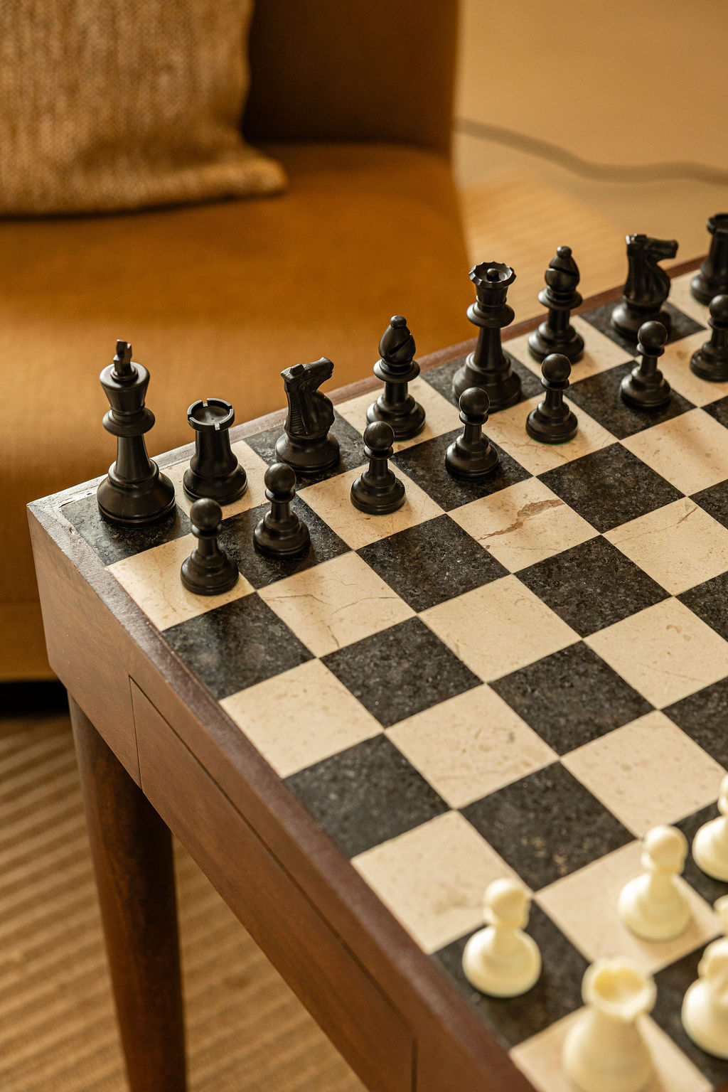 Close-up of a marble chess board mid-game